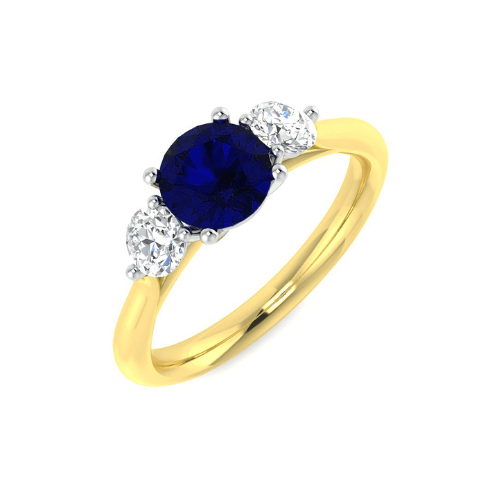 Anillo trilogía de diamantes de 0,54 ct y zafiro azul de 0,96 ct en oro amarillo de 18 k