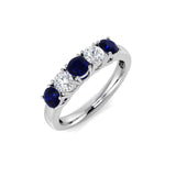 Anillo de cinco piedras con diamantes de 0,70 ct y zafiro azul de 0,50 ct en oro blanco de 18 k