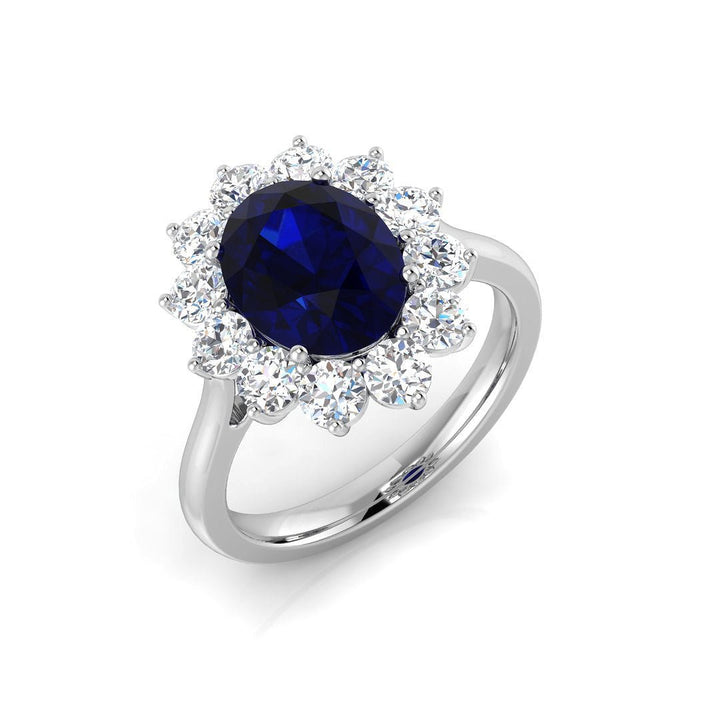 Anillo ovalado de zafiro azul de 2,58 ct con racimo de diamantes de 0,99 ct en oro blanco de 18 k
