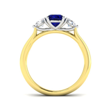 Anillo trilogía de diamantes de 0,54 ct y zafiro azul de 0,96 ct en oro amarillo de 18 k