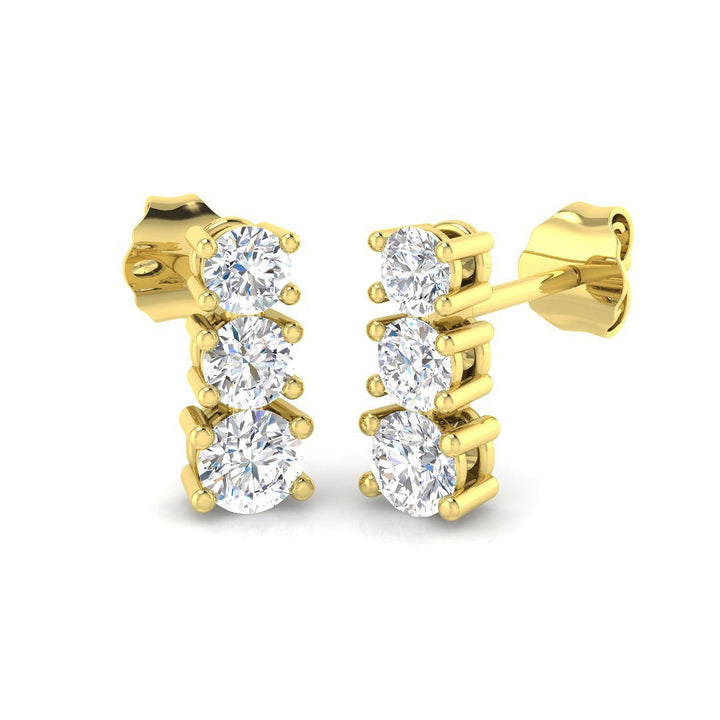 Aretes colgantes con trilogía de diamantes 0.75ct Calidad G/SI en oro amarillo de 18k