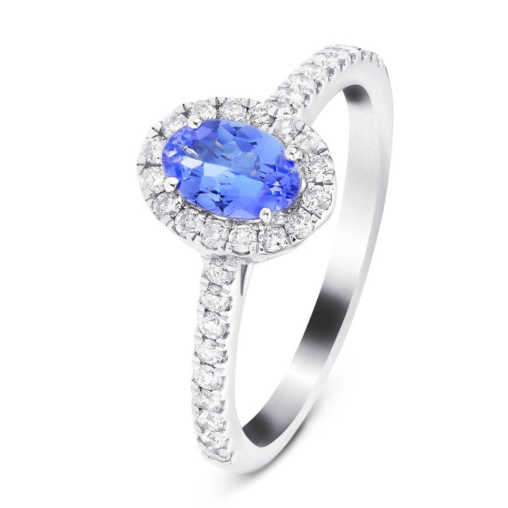 Anillo con halo de tanzanita ovalada de 0,47 quilates y diamante de 0,27 quilates en platino